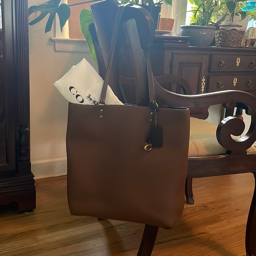 Very gently used Coach Plaza tote bag with dust bag.